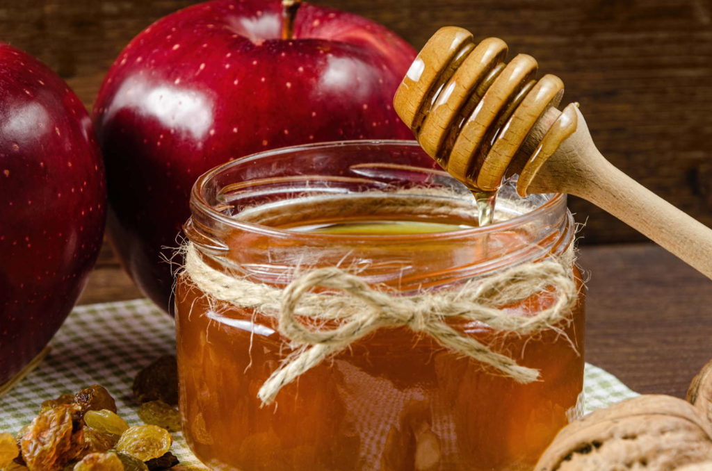 Honing in een glas Honinglepel Appel